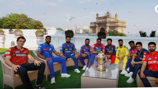 a group of men ipl 2025 posing for a photo with trpophy